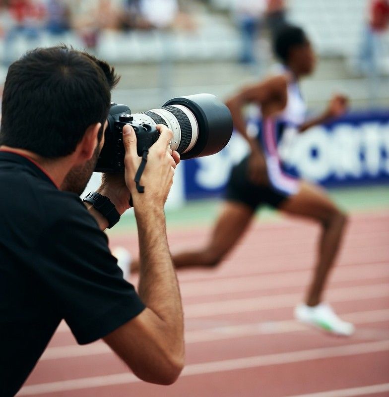 sports photographer capturing a fast‑moving athlete